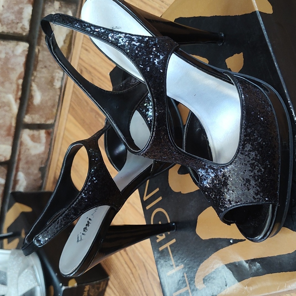 Women's black lustrous sequin heels.